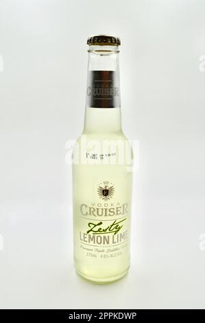 A vodka cruiser with zesty lemon lime flavor on a white background Stock Photo