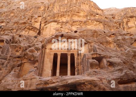 Temple above cave rooms, little Petra, Siq al-barid, Petra, Jordan Stock Photo