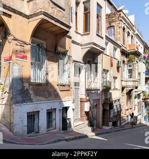 Cobblestone alley with beautiful old traditional houses in Balat district, on a summer day, Istanbul, Turkey Stock Photo