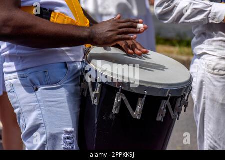 Atabaque drum player in samba presentation on brazilian city streets Stock Photo