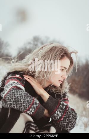Close up young lady in ethnic clothes resting outdoors portrait picture Stock Photo