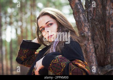 Close up mysterious lady with tribal patterns on face portrait picture Stock Photo