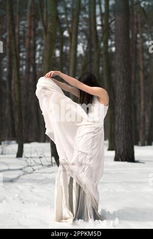 Elegant lady in white dress posing scenic photography Stock Photo