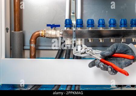 connecting the floor heating to the switchboard Stock Photo