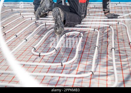 installation of underfloor heating in a new building Stock Photo