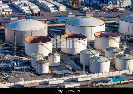 White storage tanks seen in the commercial port of Barcelona Stock Photo