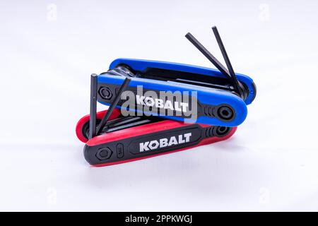 Two sets of Kobalt allen keys, one red, the other blue, stacked together on a white background Stock Photo