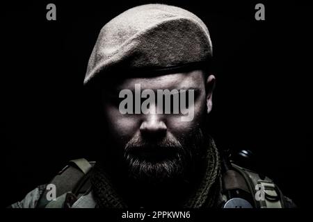 Bearded soldier in beret Stock Photo