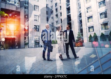 Business people walk and talk outside the office. Concept of teamwork Stock Photo