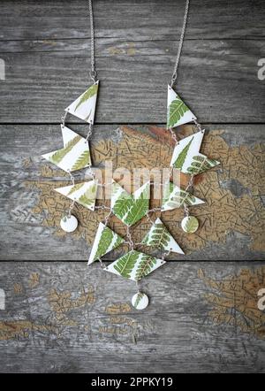 Close up stylish necklace with green leaves concept photo Stock Photo