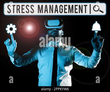 Hand writing sign Stress Management. Business approach learning ways of behaving and thinking that reduce stress Stock Photo