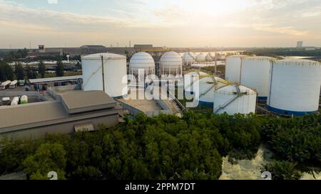 Aerial view of industrial gas storage tank in factory. LNG or liquefied natural gas storage tank. Global energy crisis. Energy price crisis. Natural gas storage industry. Above-ground gas storage tank Stock Photo