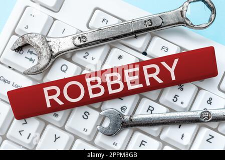 Conceptual caption Robbery. Concept meaning the action of taking property unlawfully from a person or place by force or threat of force Stock Photo
