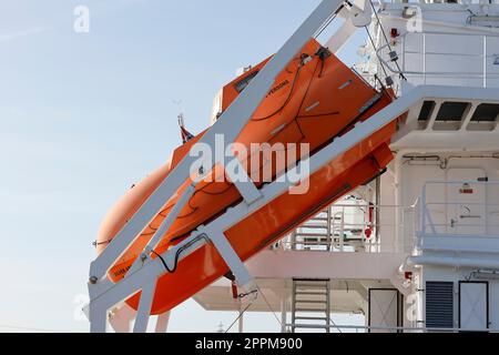 Boat to rescue the sailors on a ship Stock Photo - Alamy