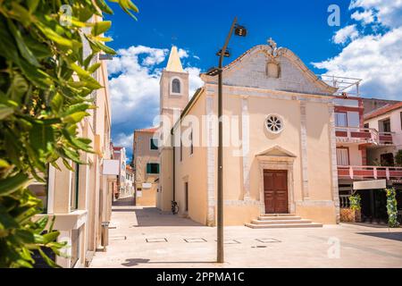 Town of Novalja square and church view, Pag island Stock Photo
