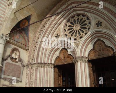 Assisi, Italy, December 10, 2020. Entrance to the Church of San Francesco in Assisi, the Basilica of St. Francis in the Sacro Convento monastery. The main temple of the Franciscan order in Umbria Stock Photo