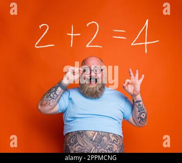 Happy fat man acts like a nerd person Stock Photo