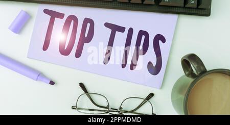 Text sign showing Top Tips. Business concept a small but particularly useful piece of practical advice Stock Photo