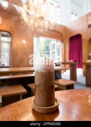 Iced coffee mocha on wooden table in coffee shop Stock Photo