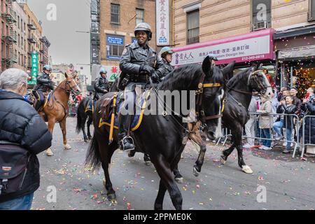 Mounted police parading through Chinatown, New York, USA Stock Photo