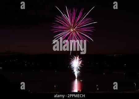 A breathtaking view of a fireworks display over the Brisbane Water in Australia Stock Photo