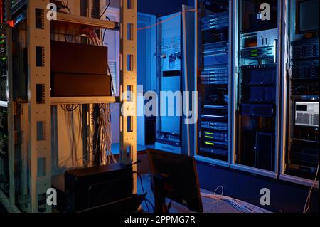 Server room of modern data center with racks and wires Stock Photo