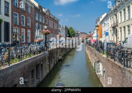 UTRECHT, THE NETHERLANDS - AUGUST 23, 2013: Urban scene, view of streets along the canal in Utrecht, the Netherlands Stock Photo