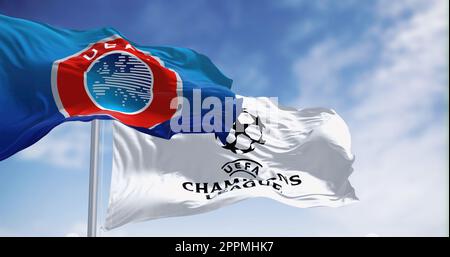 UEFA and UEFA Champions league flag waving together Stock Photo