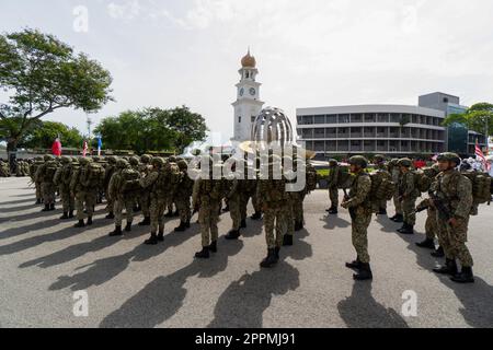 Soldier stand at street during procession under sunny day Stock Photo