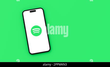 Spotify Logo on Mobile Phone Screen on Green Background with Copy Space Stock Photo