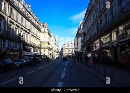 St-Honore Street. Citizens are sitting in the cafe. On the sidewalks are pedestrians Stock Photo