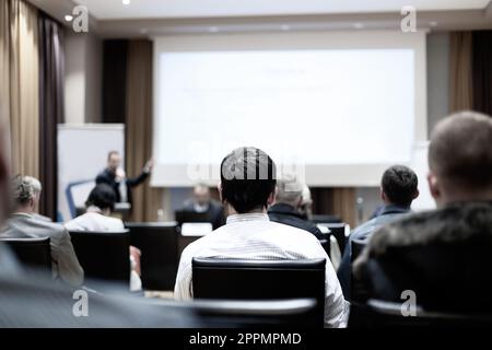 Male speeker having talk at public event. Stock Photo