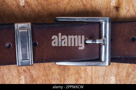 Male leather belt on the table Stock Photo