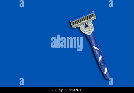 Blue shave razor on the blue Stock Photo