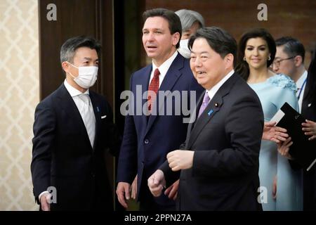 Tokyo, Japan. 22nd Apr, 2023. Florida Gov. Ron DeSantis, left, and Japanese Foreign Minister Yoshimasa Hayashi, right, are escorted to the venue of their meeting at Iikura Guest House. Credit: SOPA Images Limited/Alamy Live News Stock Photo