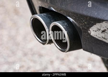 Closeup of an exhaust pipe of a car Stock Photo