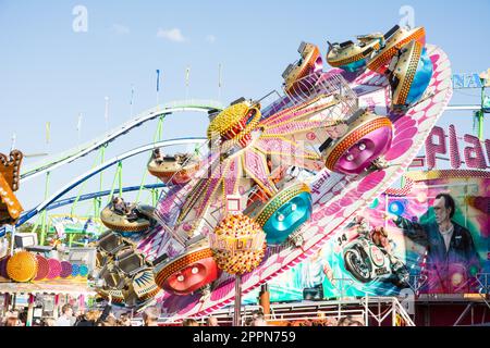 MUNICH, GERMANY - SEPTEMBER 30: Fairground rides at the Oktoberfest in Munich, Germany on September 30, 2015. The Oktoberfest is the biggest beer Stock Photo