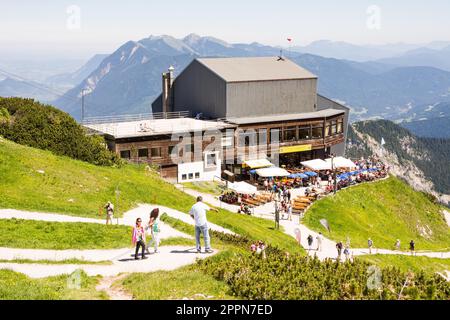 GARMISCH, GERMANY - JULY 10: Tourists at the Osterfeldkopf mountain station in Garmisch, Germany on July 10, 2016. The building is in 2033 meters Stock Photo