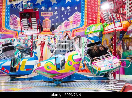 MUNICH, GERMANY - SEPTEMBER 19: Two unidentified girls in a fairground rides at the Oktoberfest in Munich, Germany on September 19, 2017 Stock Photo