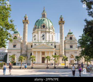 VIENNA, AUSTRIA - AUGUST 29: Tourists at the Baroque Karlskirche in Vienna, Austria on August 29, 2017. The church is considered the most outstanding Stock Photo