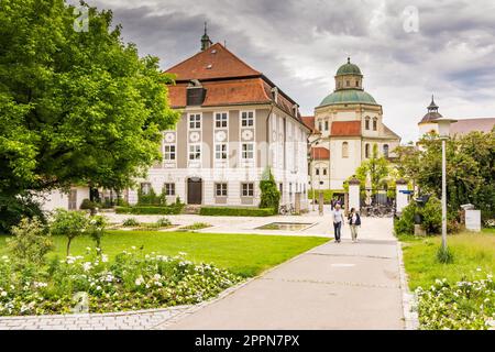 KEMPTEN, GERMANY - JUNE 9: People in park at the Basilica of Keptem, Germany on June 9, 2017. Kempten is one of the oldest cities of Germany Stock Photo