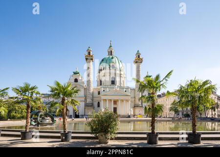 VIENNA, AUSTRIA - AUGUST 29: Tourists at the Baroque Karlskirche in Vienna, Austria on August 29, 2017. The church is considered the most outstanding Stock Photo