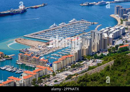 Mid-Harbour marina on the western side of the Gibraltar peninsula, sided by luxury apartment buildings Stock Photo
