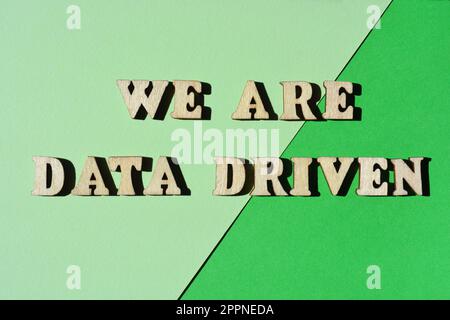 We Are Data Driven, words in wooden alphabet letters isolated on green background Stock Photo