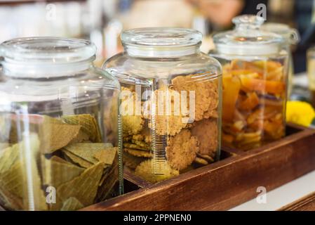 Jar full of circle homemade cookies, cones and dried fruits with copy space Stock Photo