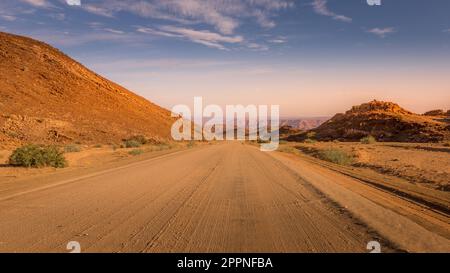 The roads of Namibia in Richtersveld Transfrontier Park near Fish River Canyon during sunset. Stock Photo