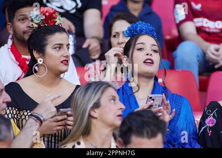 A Sevilla FC fans is seen with the typical flamenco dress for April Fair in Sevilla during the Spanish championship La Liga football match between Sevilla FC and Villarreal on April 23, 2023 at Ramon Sanchez Pizjuan stadium in Sevilla, Spain - Photo: Joaquin Corchero/DPPI/LiveMedia Stock Photo