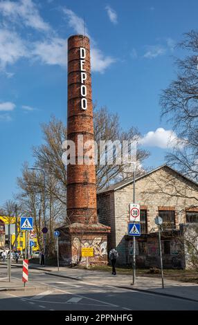 Depoo. Light up letters on old industrial chimney in Telliskivi district of Tallinn, Estonia. Stock Photo
