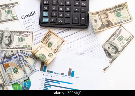 business graph chart paper pen calculator us dollar on office desk. Checking financial reports. Stock Photo