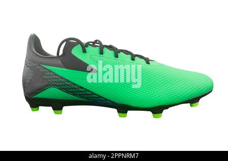 Green modern soccer boots isolated on white background. Leather football boot isolated. Professional athletics training shoes. Sports shoes. Stock Photo